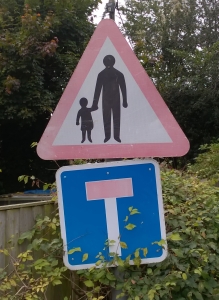 Child holding father's hand sign